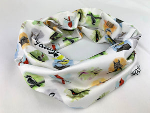 Wide headband or neck gaiter with white background and multi bird pattern